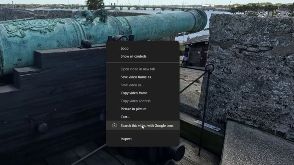 Google Chrome menu showing the Search this video with Google Lens option on a paused YouTube video