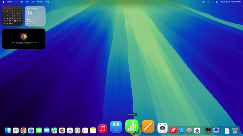 Mac Dock icons enlarging when hovering over the Numbers app with Dock magnification enabled.